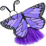 Exquisite butterfly cape costume set spread out against a clean white background with purple monarch-inspired patterned cape, purple sparkle tutu, and black antennae headband. A wearable work of art!