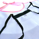 Close-up details of back or underneath side of swan cape showcasing black elastic shoulder straps for comfort and safe wearability