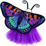 Exquisite butterfly cape costume set spread out against a clean white background with purple artemis-inspired patterned cape, purple sparkle tutu, and black antennae headband. A wearable work of art!