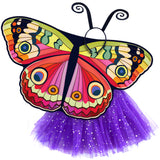 Exquisite butterfly cape costume set spread out against a clean white background with bebearia buckeye-inspired patterned cape, purple sparkle tutu, and black antennae headband. A wearable work of art!