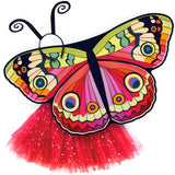 Exquisite butterfly cape costume set spread out against a clean white background with bebearia buckeye-inspired patterned cape, red sparkle tutu, and black antennae headband. A wearable work of art!