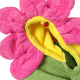 Close-up of Children's Hooded Towel - Flower design, highlighting delicately gathered pink terry cloth petals, a yellow flower center hood, and a sweet ladybug decorative button. A whimsical and charming bath time accessory for kids.