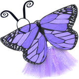 Exquisite butterfly cape costume set spread out against a clean white background with purple monarch-inspired patterned cape, light purple sparkle tutu, and black antennae headband. A wearable work of art!