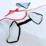 Close-up details of back or underneath side of cape showcasing black elastic shoulder straps for comfort and safe wearability